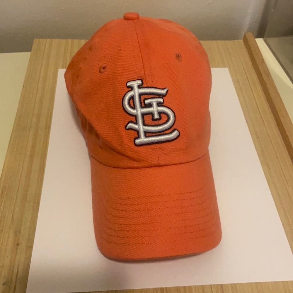 St. Louis Cardinals hat. Light orange/salmon/peach color